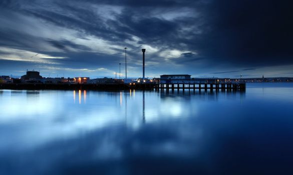 Tranquil sea at the mouth of weymouth harbour in dorset england