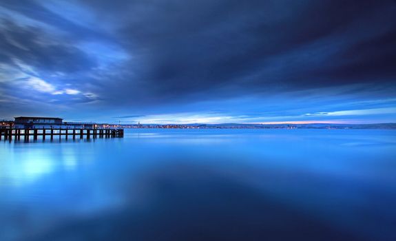 Tranquil sea at the mouth of weymouth harbour in dorset england