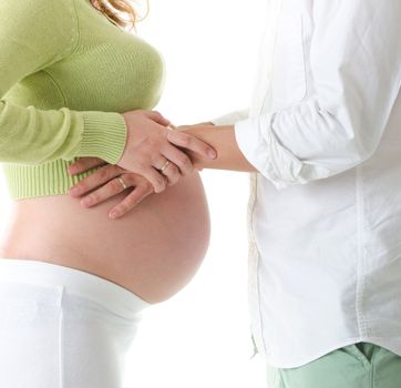 Mom and Dad with hands on the baby over white background