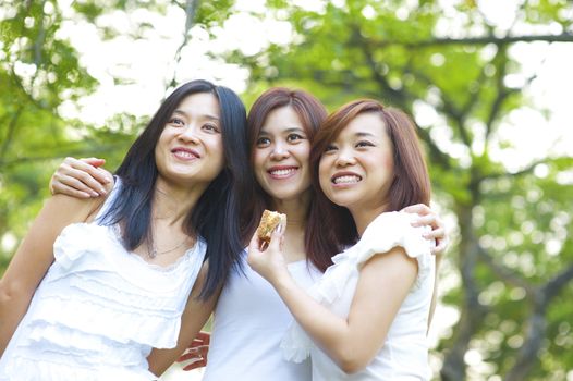 Asian young girls having fun outdoor park