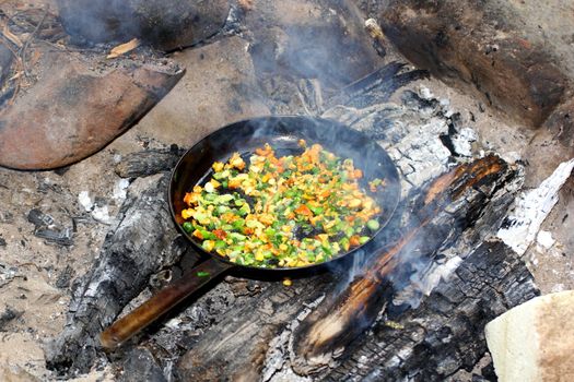 frying pan filled with yellow mushrooms and onion 