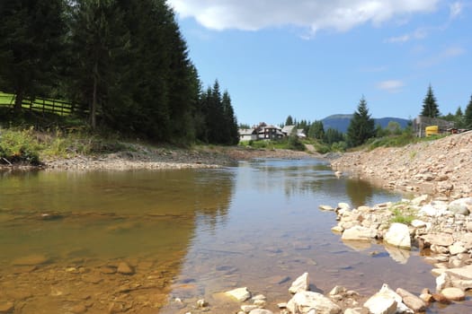 mountain river destroyed by exploitation of stone