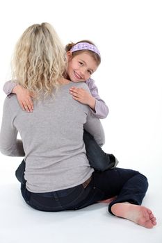 mother holding her little girl