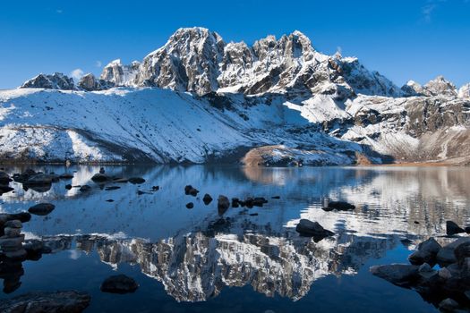 Sacred Gokyo Lake and mountain peak in Himalayas. Altitude 4800 m