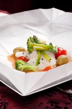 fish with vegetables in the parchment