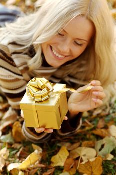 woman take autumn gift in park