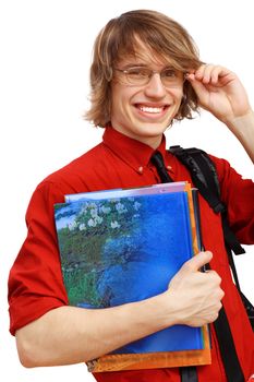 Happy smiling student standing and holding books