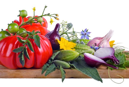 tomatoes, cucumbers and onions on a wooden board