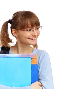 Happy smiling student standing and holding books