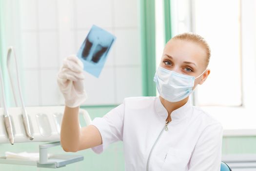 A portrait of a dental worker, dentist or assistant