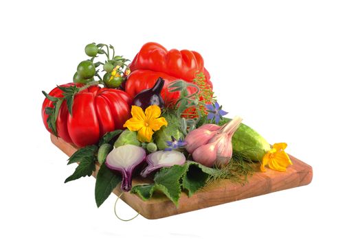 tomatoes, cucumbers and onions on a wooden board