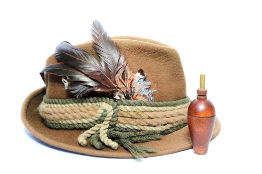 vintage hunting hat and wooden game call for foxes and hazel grouse