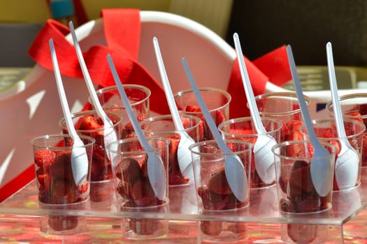 Rows of strawberries in plastic  cups