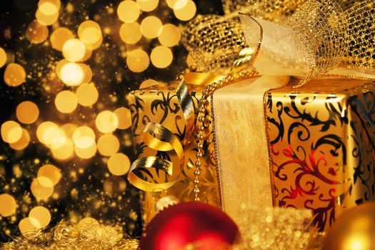 luxury golden christmas gift with sparkling background