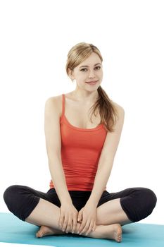 happy young fitness woman making a break in tailor-seat on white background