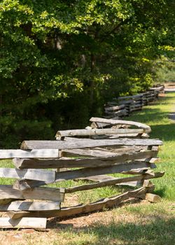 Traditional split rail fence by side of woods or forest