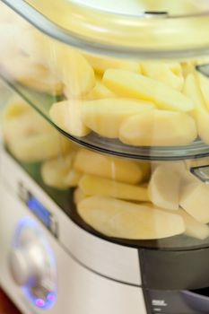 steam cooker with potatoes