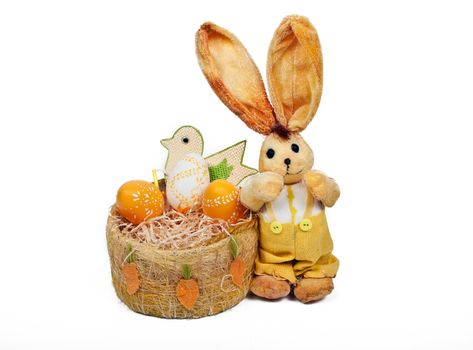 easter rabbit with bird and basket full of eggs