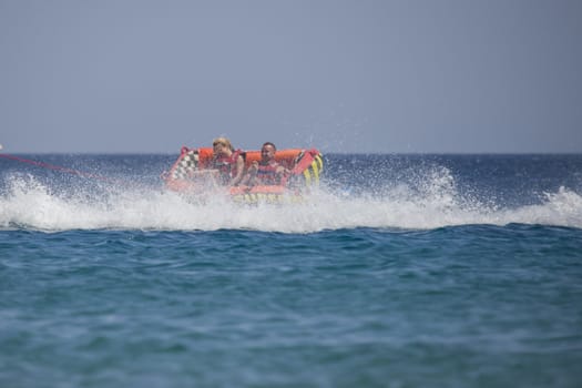 The speed boat kept probably a little too fast speed when the rubber boat with two people overturned. The picture is shot from the beach in Naama Bay one day in April 2013.