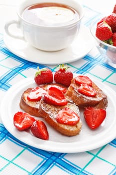 French toasts with powdered sugar and a strawberry