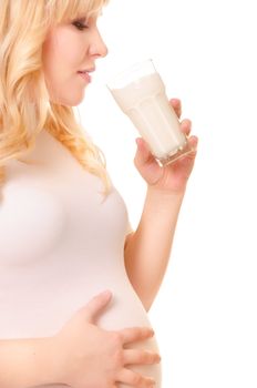 Pregnant woman with a glass of milk drink isolated on white background