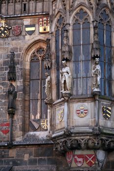 Closeup of Prague Town Hall window with sculptures and arms, Czech Republic