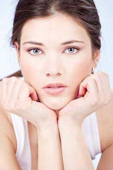 Portrait of a pretty brunette blue eyes woman