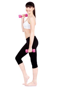 Young woman doing fitness exercises with two weights, isolated on white