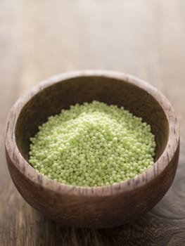 close up of a bowl of green sago pearls
