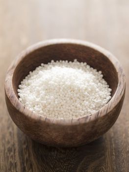 close up of a bowl of white sago pearls