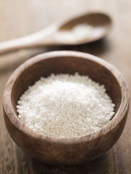 close up of a bowl of white sago pearls