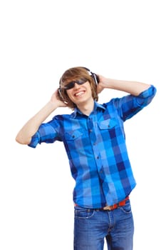 Happy smiling young man dancing and listening to music