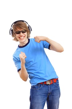 Happy smiling young man dancing and listening to music