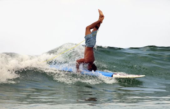 Man-surfer in ocean. Bali. Indonesia