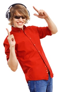 Happy smiling young man dancing and listening to music