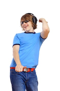 Happy smiling young man dancing and listening to music