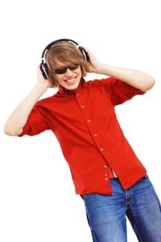 Happy smiling young man dancing and listening to music