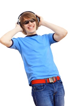 Happy smiling young man dancing and listening to music