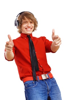 Happy smiling young man dancing and listening to music