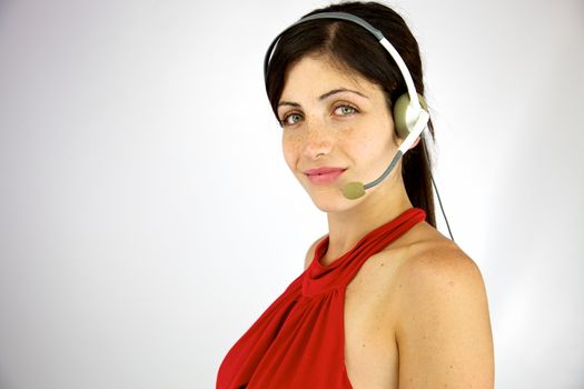 Good looking young woman working with headset