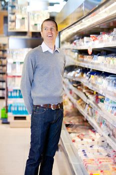 Portrait of a happy smiling customer in a grocery store