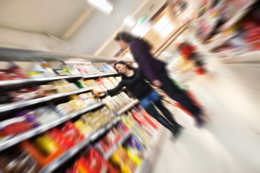 Tilted blur image of women shopping in shopping in shopping centre