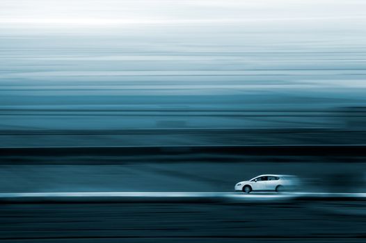 Abstract image of a car and speed in blue toned