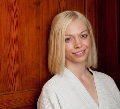 Portrait of a woman in an old wooden spa interior