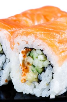 Traditional japanese food roll made of salmon close up
