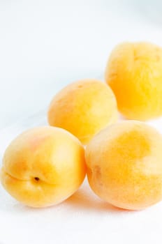 Handful of apricots on the table close up