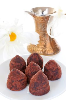 Truffles on a plate  turish coffee pot on background