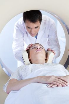 Doctor preparing the patient for MRI scan test