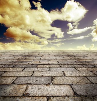 Architectural background with cobbled streets and sky