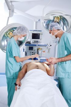 Patient being operated by the surgeons in operation theatre